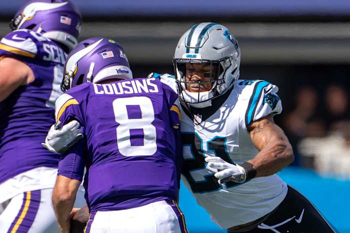 Oct 1, 2023; Charlotte, North Carolina, USA; Carolina Panthers safety Jeremy Chinn (21) sacks Minnesota Vikings quarterback Kirk Cousins (8) in the second quarter at Bank of America Stadium.